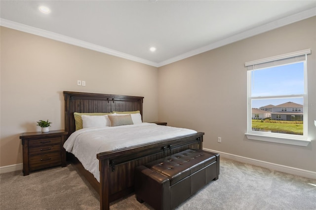 bedroom with ornamental molding and light carpet