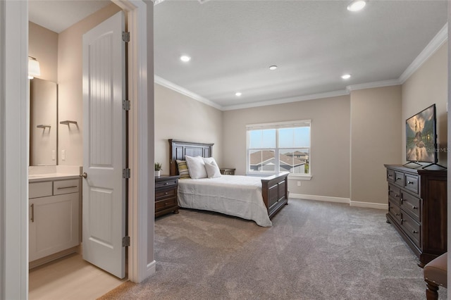 carpeted bedroom featuring connected bathroom and crown molding