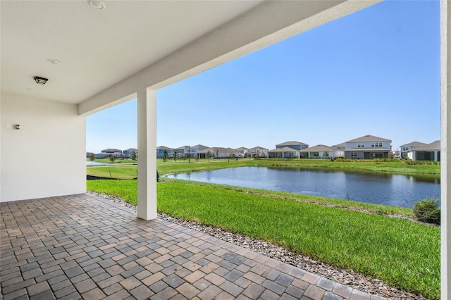 view of patio with a water view