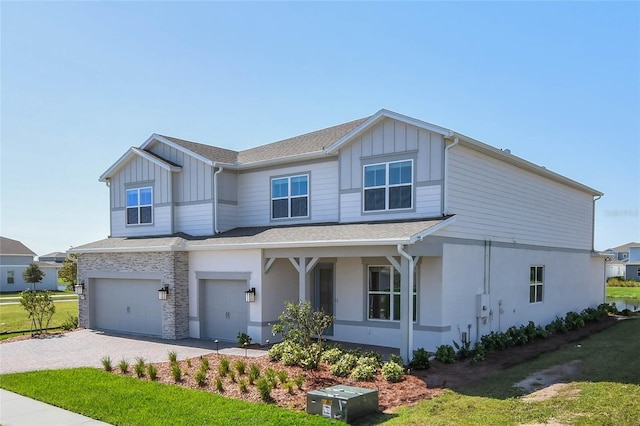 view of front of house with a front lawn and a garage