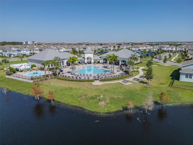 birds eye view of property with a water view