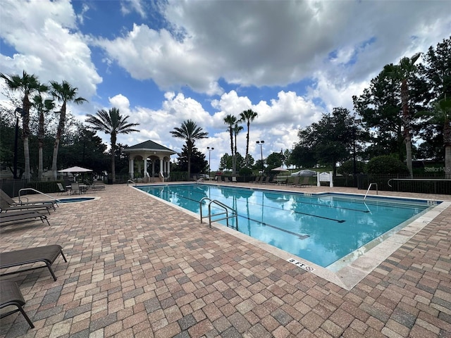 view of swimming pool featuring a patio area