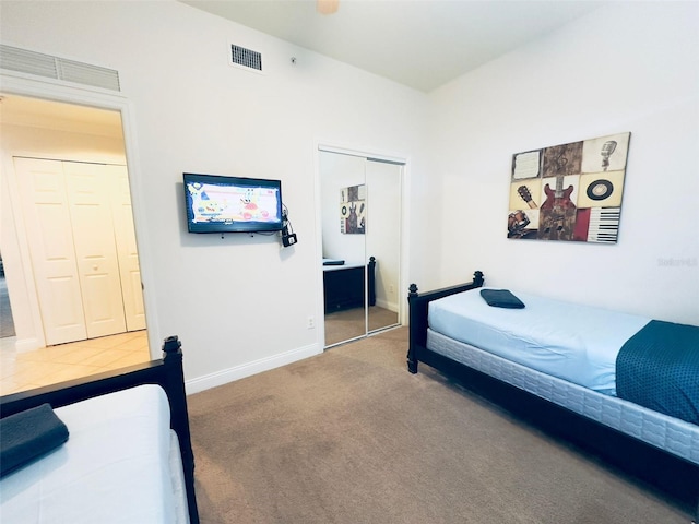 carpeted bedroom featuring a closet