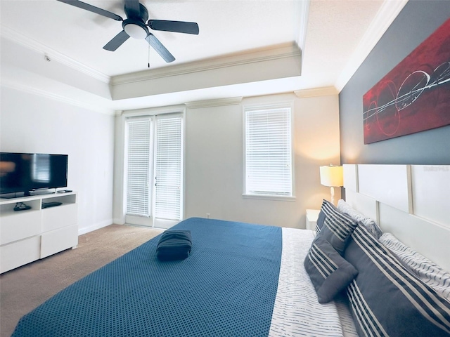 carpeted bedroom with ornamental molding and ceiling fan