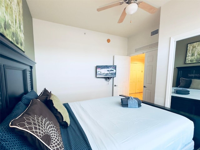 bedroom featuring connected bathroom and ceiling fan