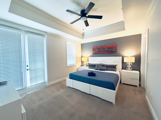 bedroom featuring crown molding, ceiling fan, carpet, and a raised ceiling