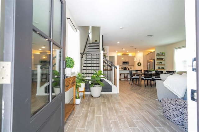 stairway with hardwood / wood-style flooring