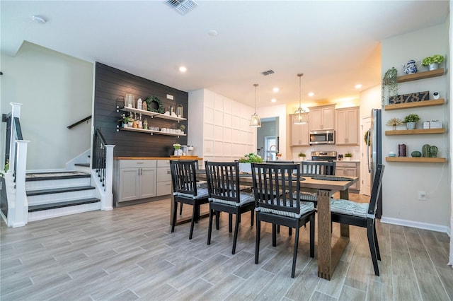 dining space featuring light wood-type flooring