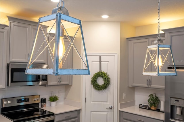 kitchen with stainless steel appliances and gray cabinetry