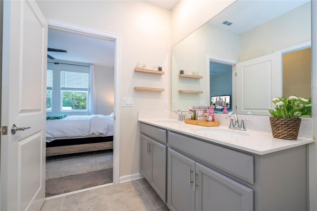 bathroom with vanity and tile patterned flooring