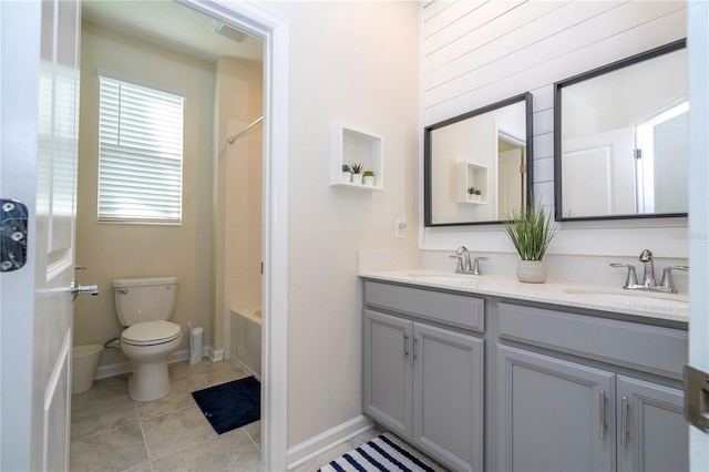 full bathroom featuring  shower combination, vanity, toilet, and tile patterned floors