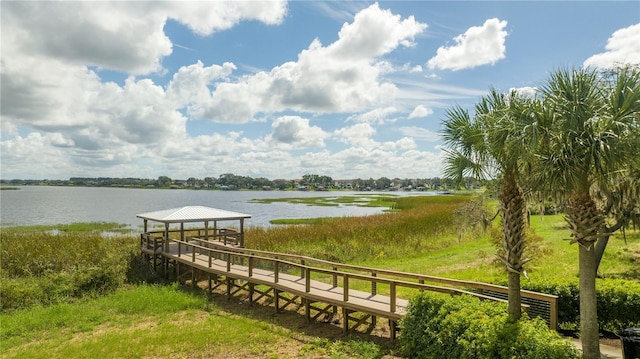 dock area with a gazebo and a water view