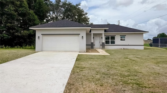 single story home featuring a front yard and a garage