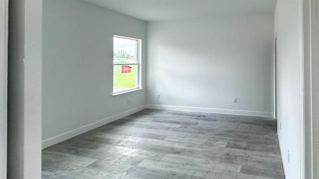 spare room featuring light wood-type flooring