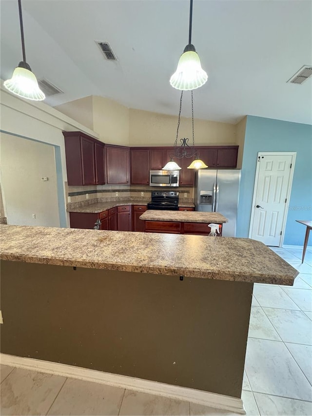 kitchen with backsplash, hanging light fixtures, visible vents, and appliances with stainless steel finishes