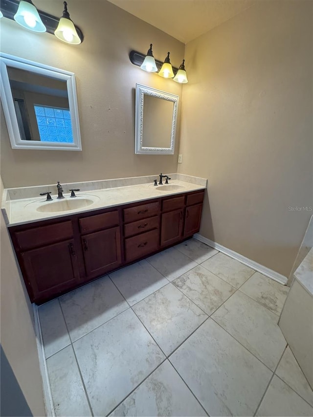 full bath featuring a sink and double vanity