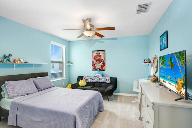 bedroom featuring ceiling fan and light colored carpet