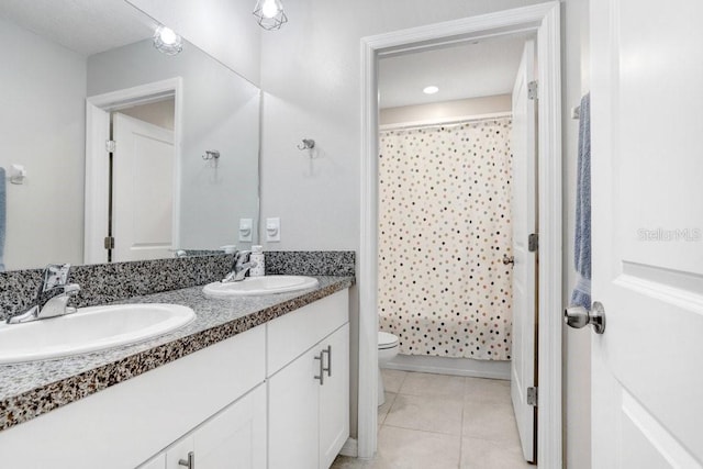 full bathroom with toilet, shower / bath combo, vanity, and tile patterned floors