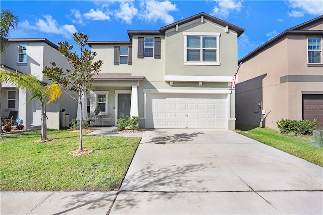 view of front of property with a front lawn and a garage