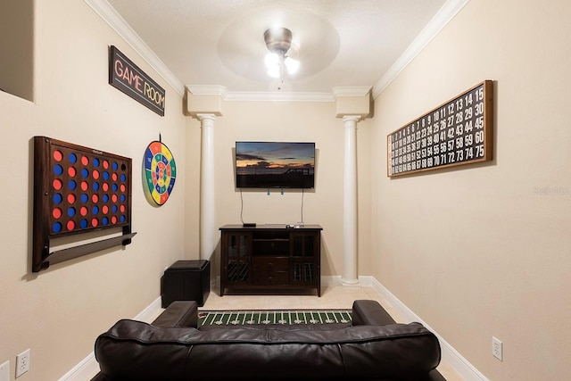 living room with ceiling fan, ornamental molding, and ornate columns