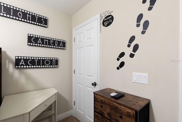 mudroom with a textured ceiling