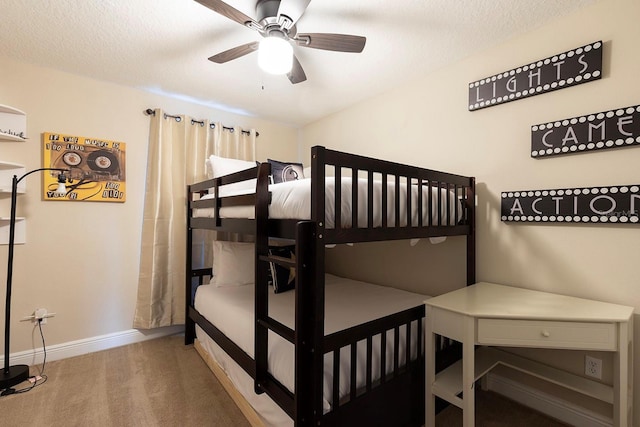 carpeted bedroom featuring a textured ceiling and ceiling fan