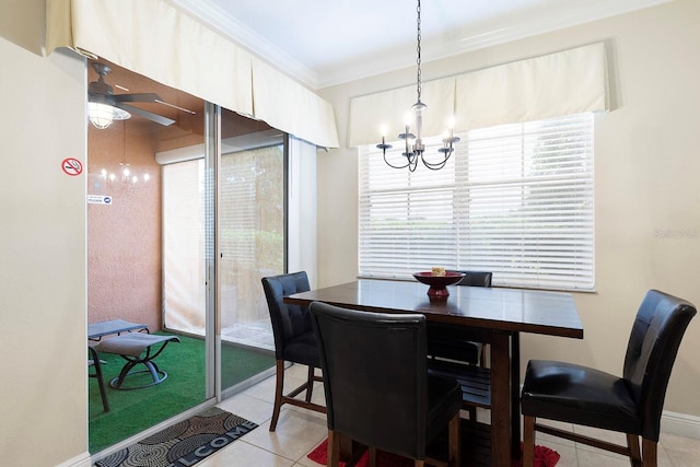 dining space featuring light tile patterned flooring, crown molding, and ceiling fan with notable chandelier