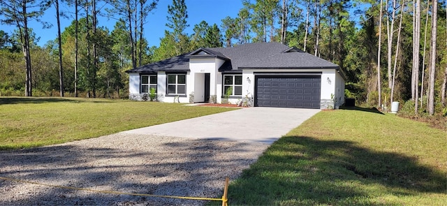 view of front facade featuring a front yard and a garage