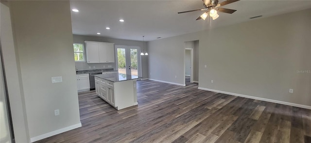 kitchen featuring dark hardwood / wood-style floors, white cabinets, dishwasher, and a kitchen island