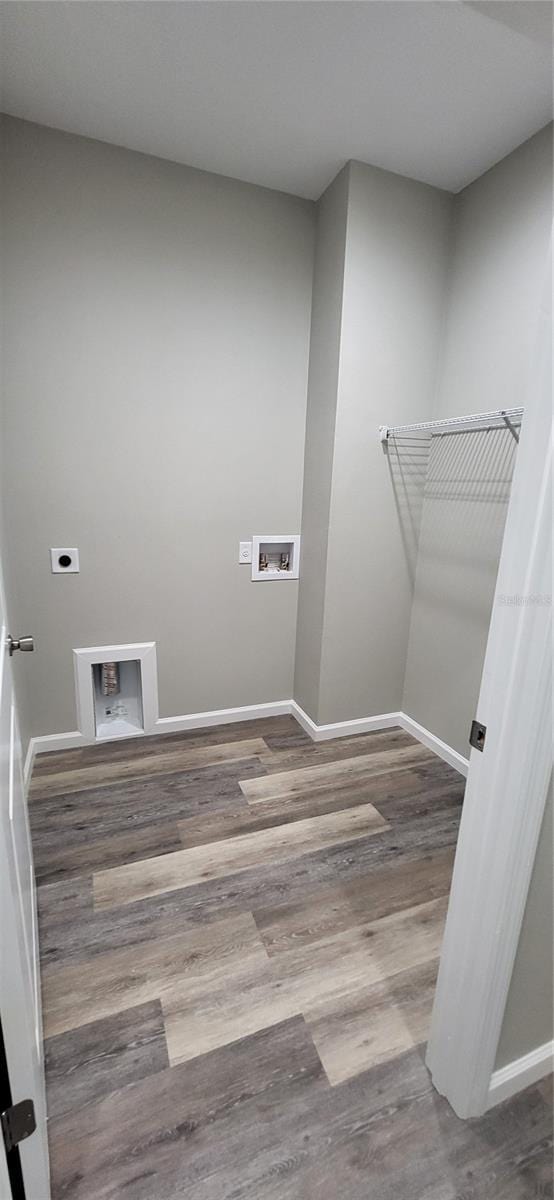 clothes washing area with hardwood / wood-style flooring, washer hookup, and hookup for an electric dryer