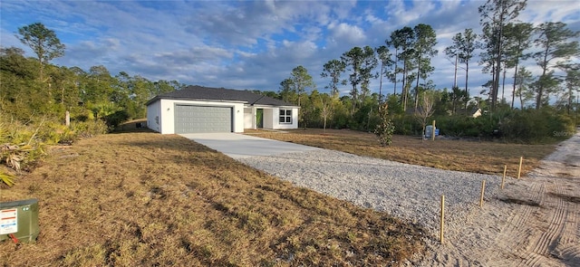 ranch-style house featuring a garage