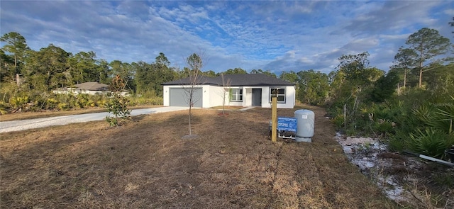 ranch-style house featuring a garage