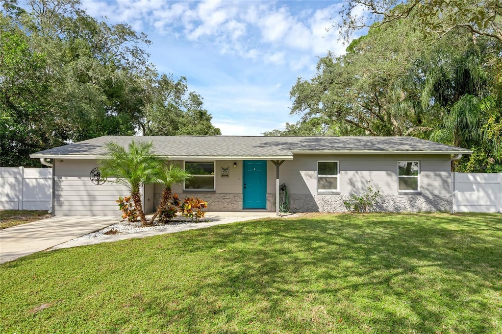 ranch-style house with a front lawn