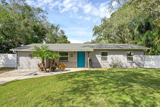 ranch-style house with a front lawn