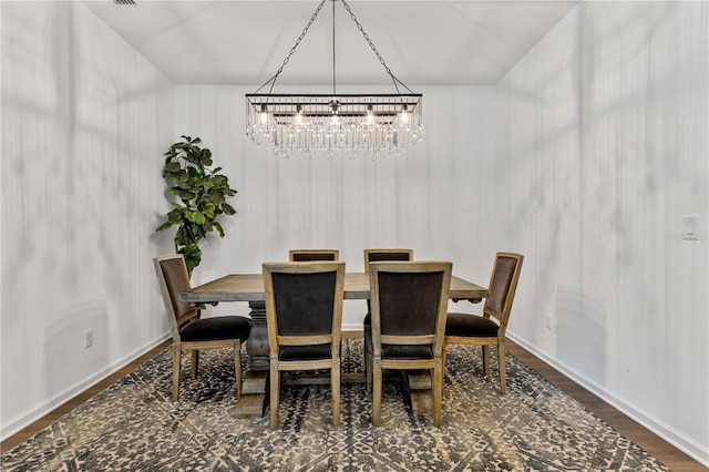 890 Terrapin Dr, Debary, FL 32713 - dining room with baseboards, an inviting chandelier, and wood finished floors
