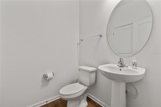 890 Terrapin Dr, Debary, FL 32713 - bathroom with baseboards, a sink, toilet, and wood finished floors