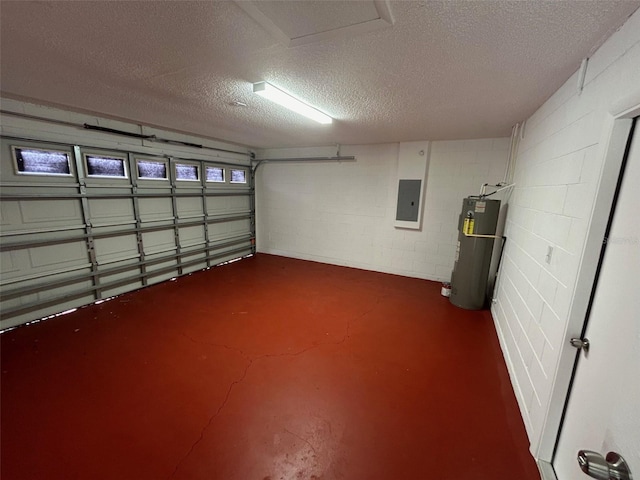 garage featuring water heater and electric panel