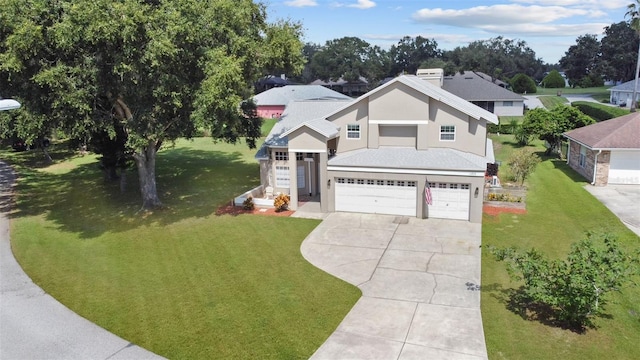 view of front of property with a garage and a front yard