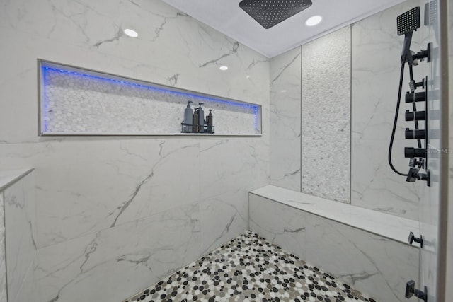 bathroom featuring a tile shower