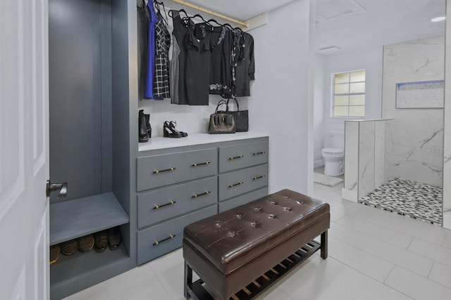 walk in closet featuring light tile patterned floors