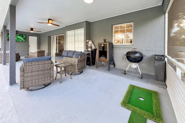 view of patio featuring outdoor lounge area and ceiling fan