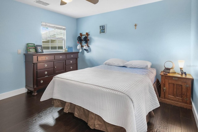 bedroom featuring ceiling fan and dark hardwood / wood-style flooring