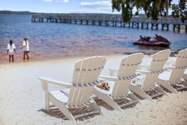 exterior space with a water view and a view of the beach