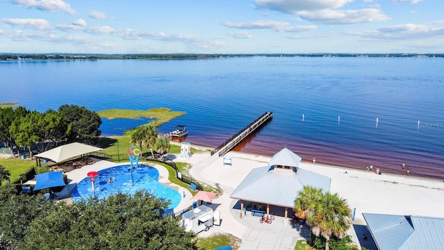 bird's eye view with a water view and a view of the beach