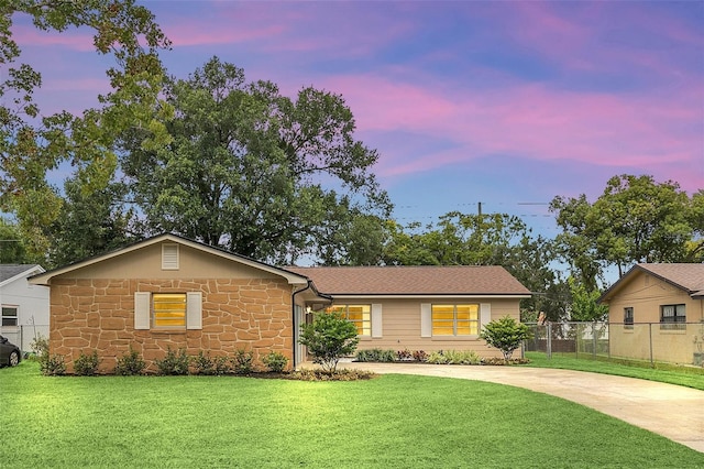 ranch-style house with a lawn