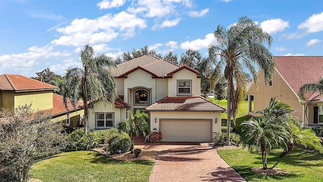 212 Crestrun Loop, Leesburg, FL 34748 - mediterranean / spanish house featuring decorative driveway, stucco siding, a tile roof, and a front yard