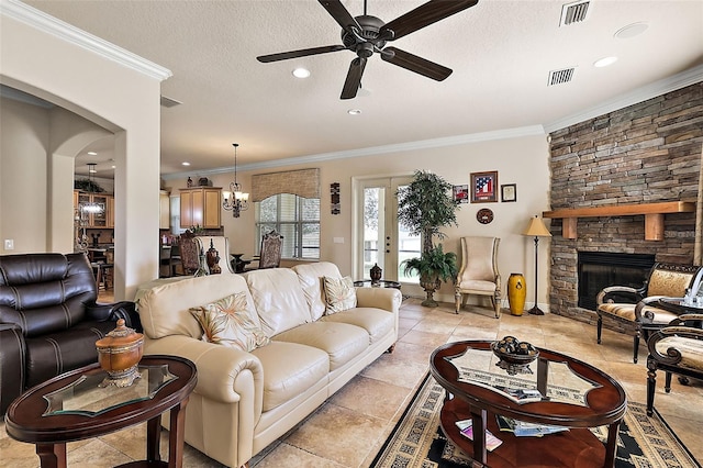 212 Crestrun Loop, Leesburg, FL 34748 - living room with ceiling fan, a stone fireplace, crown molding, a chandelier, and recessed lighting