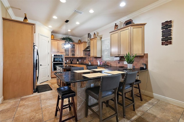 212 Crestrun Loop, Leesburg, FL 34748 - kitchen featuring stainless steel appliances, backsplash, ornamental molding, a peninsula, and a breakfast bar area