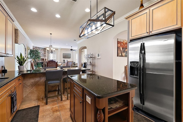 212 Crestrun Loop, Leesburg, FL 34748 - kitchen featuring stainless steel fridge with ice dispenser, arched walkways, a chandelier, recessed lighting, and open floor plan
