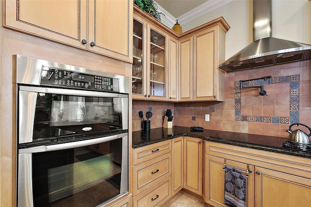 212 Crestrun Loop, Leesburg, FL 34748 - kitchen featuring wall chimney exhaust hood, double oven, crown molding, tasteful backsplash, and dark stone countertops